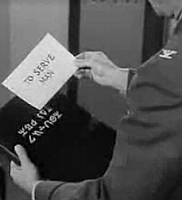 image from Twilight Zone Episode, To Serve Man, showing the book with the alien title on the front and its translation.